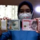 Rupiah Menguat Tipis ke Rp16.300 per Dolar AS, Pasar Tunggu Sinyal The Fed